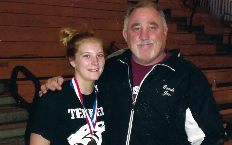 Coach Joe Rigous with Female Wrestling Student
